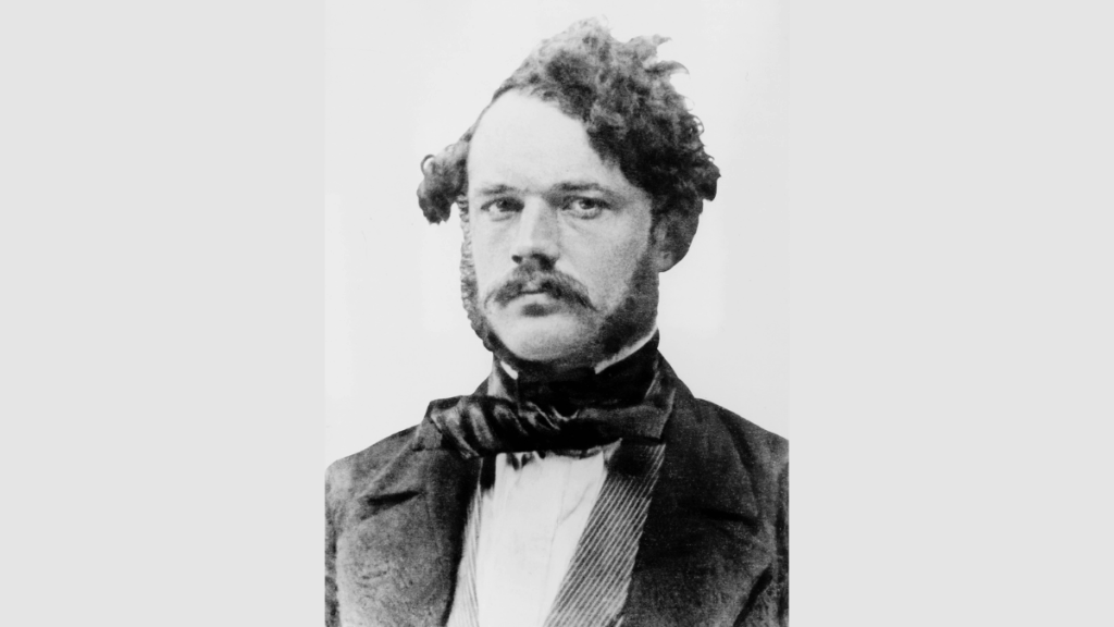 Schwarz-Weiß-Foto von Werner-von-Siemens im schwarzen Anzug mit weißem Hemd und schwarzer Fliege